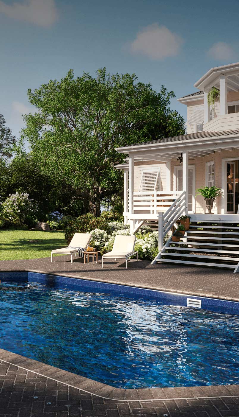 inground pool with paver decking in picturesque New England yard